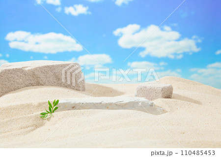 Gray blocks of stones on white sand on blue sky background. Simulate beach nature scene. Minimal background for cosmetic or product presentation. Front view 110485453