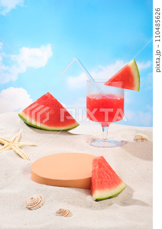 Watermelons and snail shells are decorated on a sandy background with a round platform. Empty space for product display. Summer, tropical, picnic theme. 110485626
