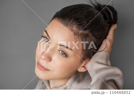 Portrait of a young pretty girl in a hoodie Portrait of a young pretty girl in a hoodie 110488852