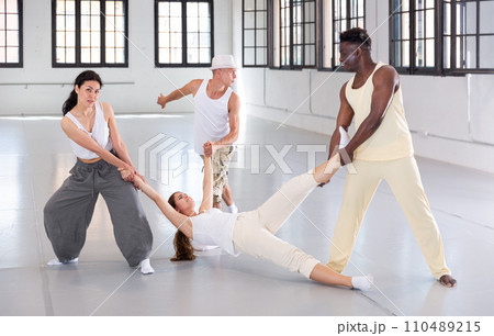 Four artists rehearsing spectacle scene 110489215