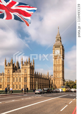 Big Ben with bridge against flag of England in London, England, UK 110493139