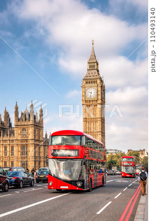 Big Ben with typical red buses on the bridge in London, England, UK 110493140