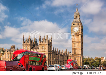Big Ben with typical red buses on the bridge in London, England, UK Big Ben with typical red buses on the bridge in London, England, UK 110493142