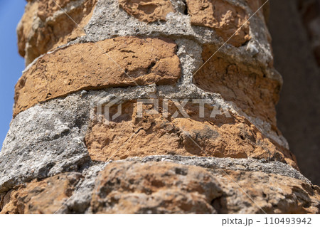 damaged red bricks from the wall of an ancient building damaged red bricks from the wall of an ancient building 110493942