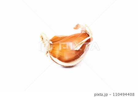 Garlic clove isolated on white background closeup Garlic clove isolated on white background closeup 110494408