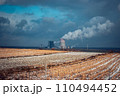 Panoramic view of nuclear power plant with wheat field Nuclear power plant cooling towers, big chimneys 110494452