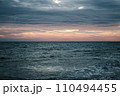 Winter Mediterranean sea waves landscape photo. Peaceful sunset time. Calm waves during vacation. 110494455