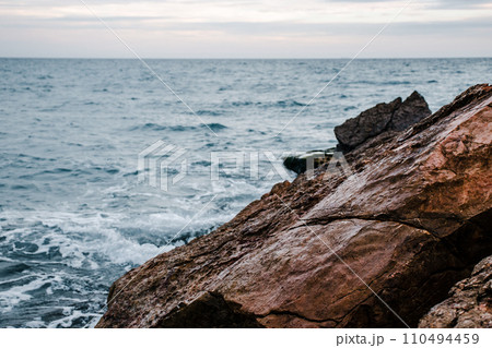 Winter sea with stones on the beach concept photo. Underwater rock. Mediterranean sea. 110494459