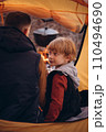 Man and boy tourists autumn time leisure, vacation hiking or traveling touristic activity. Family camping, father and little son relax in forest camp. 110494690