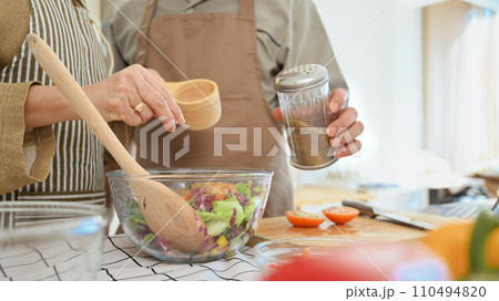 Senior couple making healthy vegetarian food at home. Healthy eating concept. Senior couple making healthy vegetarian food at home. Healthy eating concept. 110494820