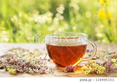 Cup of herbal tea with dried herbs Cup of herbal tea with dried herbs 110495151