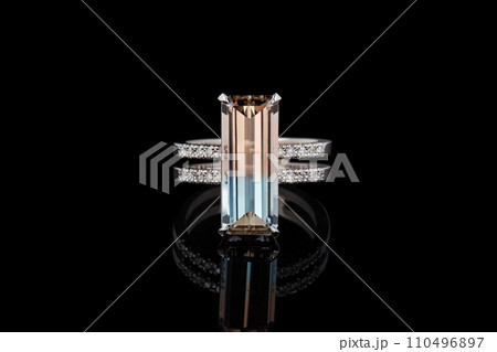beautiful gold ring with topaz gemstones on a black background beautiful gold ring with topaz gemstones on a black background 110496897