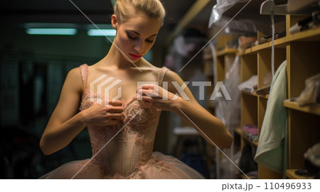 The ballet dancer, in full costume, reflects on the upcoming performance, creating a sense of anticipation and serenity 110496933