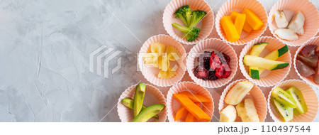 BLW Baby-Led Weaning concept - sliced foods, top view BLW Baby-Led Weaning concept - sliced foods, top view 110497544