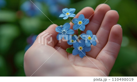 AI-generated content. A person holding a small blue flower in their hand, AI 110498019