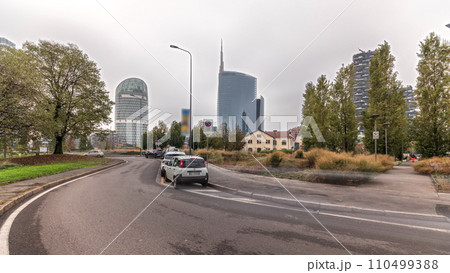 Panorama showing skyscrapers and towers from park with green lawn timelapse in Milan Panorama showing skyscrapers and towers from park with green lawn timelapse in Milan 110499388