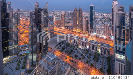 High-rise buildings on Sheikh Zayed Road in Dubai aerial night to day timelapse, UAE. High-rise buildings on Sheikh Zayed Road in Dubai aerial night to day timelapse, UAE. 110499434