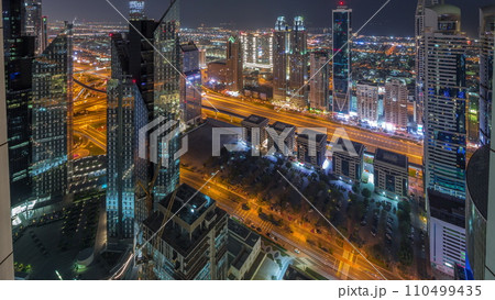 High-rise buildings on Sheikh Zayed Road in Dubai aerial all night timelapse, UAE. High-rise buildings on Sheikh Zayed Road in Dubai aerial all night timelapse, UAE. 110499435