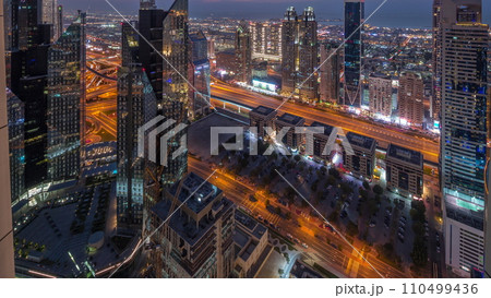 High-rise buildings on Sheikh Zayed Road in Dubai aerial day to night timelapse, UAE. 110499436