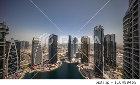 Sunrise over tall residential buildings at JLT aerial all day timelapse Sunrise over tall residential buildings at JLT aerial all day timelapse 110499468