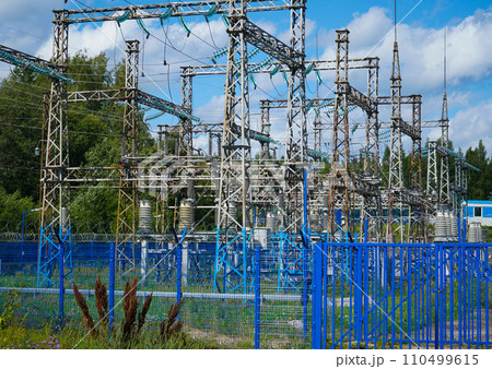 High-voltage transformer substation behind barbed-wire chain-link fence High-voltage transformer substation behind barbed-wire chain-link fence 110499615