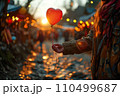 Floating on Love's Breeze, a Red Balloon Held Aloft, a Valentine's Day Sentiment in Hand 110499687