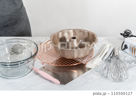 Kitchen tools for baking bundt cakes on the kitchen counter. 110500127