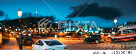Panoramic Streetview Night Boke Bokeh Blurred Background. Blurred Boke Bokeh Background Of City Night Illumination. Abstract Blurred Bokeh Architectural Urban Backdrop 110500496