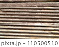 A textured processed wooden surface, a highly detailed close-up of wood grain 110500510