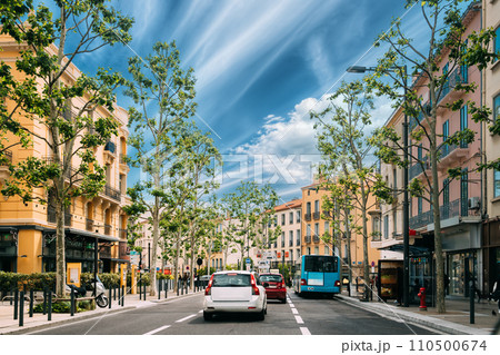 Perpignan, France. Traffic On Place Jean Payra In Sunny Spring Day Perpignan, France. Traffic On Place Jean Payra In Sunny Spring Day 110500674