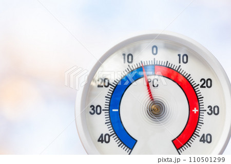 Outdoor thermometer indicates sub-zero temperature 110501299