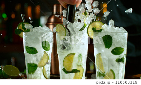 Close-up of preparing mojito cocktails on a bar Close-up of preparing mojito cocktails on a bar 110503319