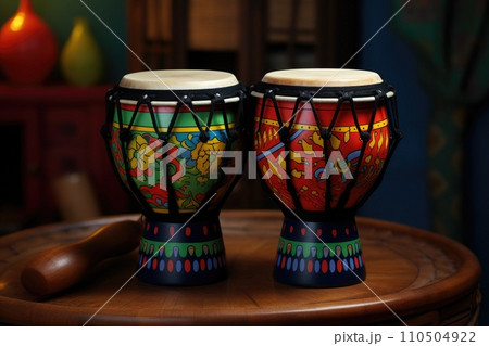 Two colorful bongo drums on a table 110504922