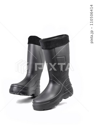 black high insulated specialized boots for hunting off-road fishing and traveling in the cold season on a white background black high insulated specialized boots for hunting off-road fishing and traveling in the cold season on a white background 110506414