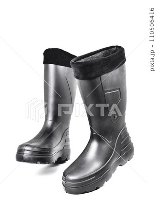 black high insulated specialized boots for hunting off-road fishing and traveling in the cold season on a white background 110506416