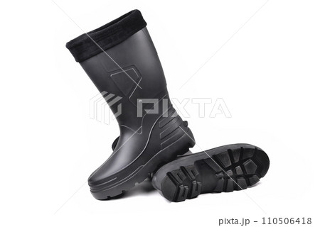 black high insulated specialized boots for hunting off-road fishing and traveling in the cold season on a white background isolate 110506418