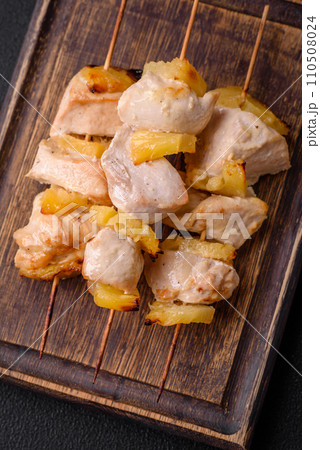 Delicious chicken or turkey kebab with pineapple pieces on skewers Delicious chicken or turkey kebab with pineapple pieces on skewers 110508024