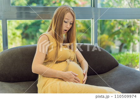 Expectant woman experiences discomfort, feeling unwell during pregnancy 110509974