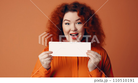 beautiful young redhead woman showing blank card isolated on orange background. beautiful young redhead woman showing blank card isolated on orange background. 110510191