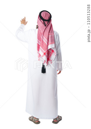 Back view of an Arab man in thobe standing on white isolated background 110513288