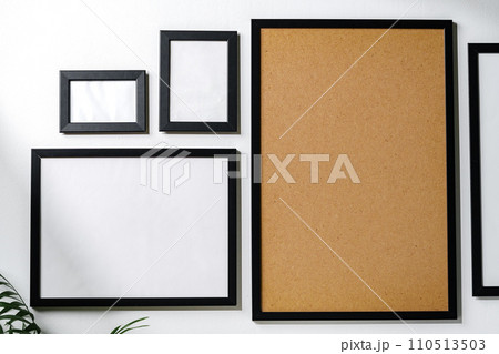 Set of black frames on white wall with copy space Set of black frames on white wall with copy space 110513503