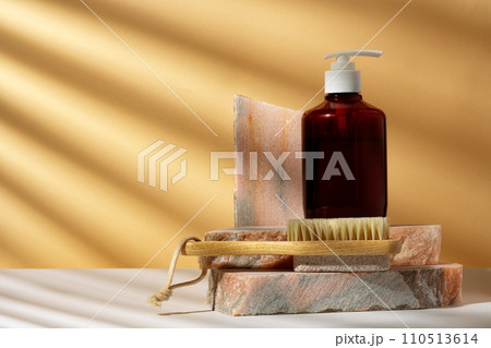 Cosmetic package dispenser with granite stone studio shot Cosmetic package dispenser with granite stone studio shot 110513614