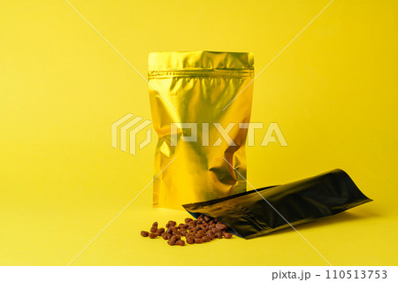 Cat food on yellow background studio shot 110513753