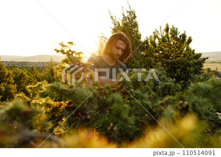 Casual man hiker outdoors in gray T-shirt outdoors portrait 110514091
