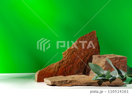 Mock up stone podium against green background 110514161
