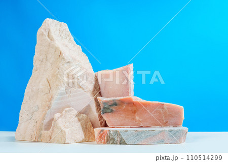Pieces of granite stone against blue background 110514299