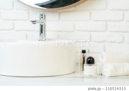 Perfume bottle in a modern bathroom close up 110514313