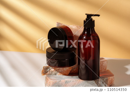 Cosmetic products packages and granite stone studio shot 110514350