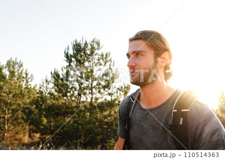 Portrait of hiker man with backpack trekking in the mountains 110514363