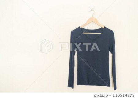woman t-shirt hanging on wall 110514875